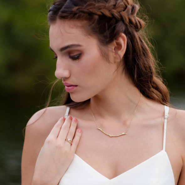 Model wears a solid gold Sapling necklace