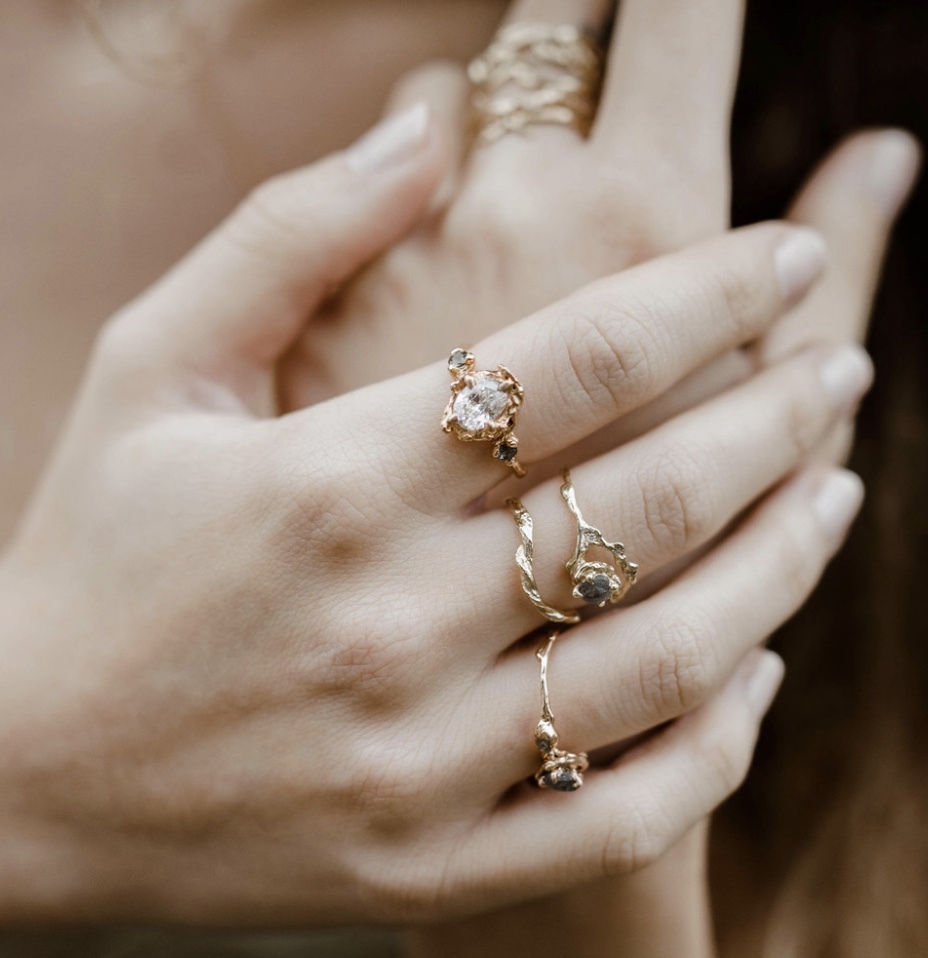 a woman bejeweled with olivia ewing engagement rings