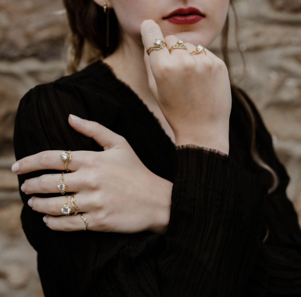 A lifestyle or product shot of a nature-inspired diamond ring 'nature inspired diamond engagement ring by Olivia Ewing Jewelry'